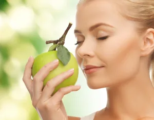 http://www.dreamstime.com/royalty-free-stock-images-woman-smelling-apple-image38289999